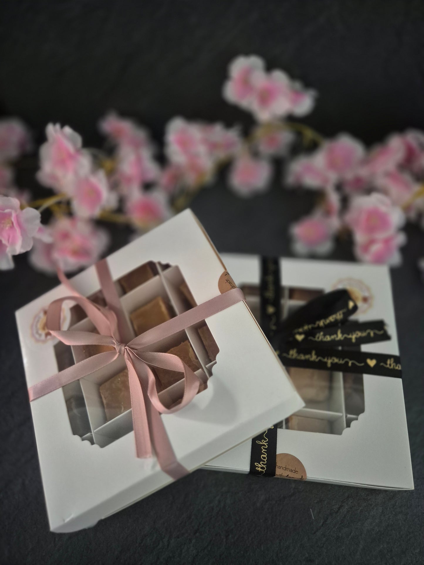2 large hand crafted 10 piece fudge boxes stacked against each other