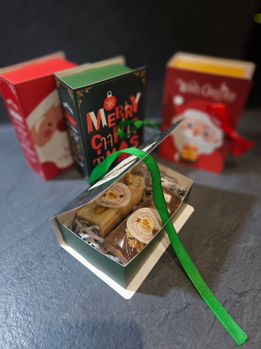Green novelty book open with Christmas themed packaging showing 2 large fudge bars,