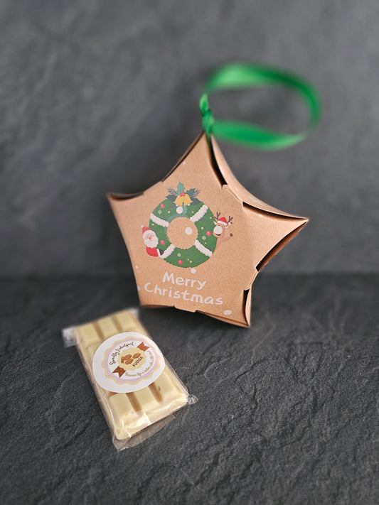 Christmas star packaging with white chocolate fudge bar and dark work surface