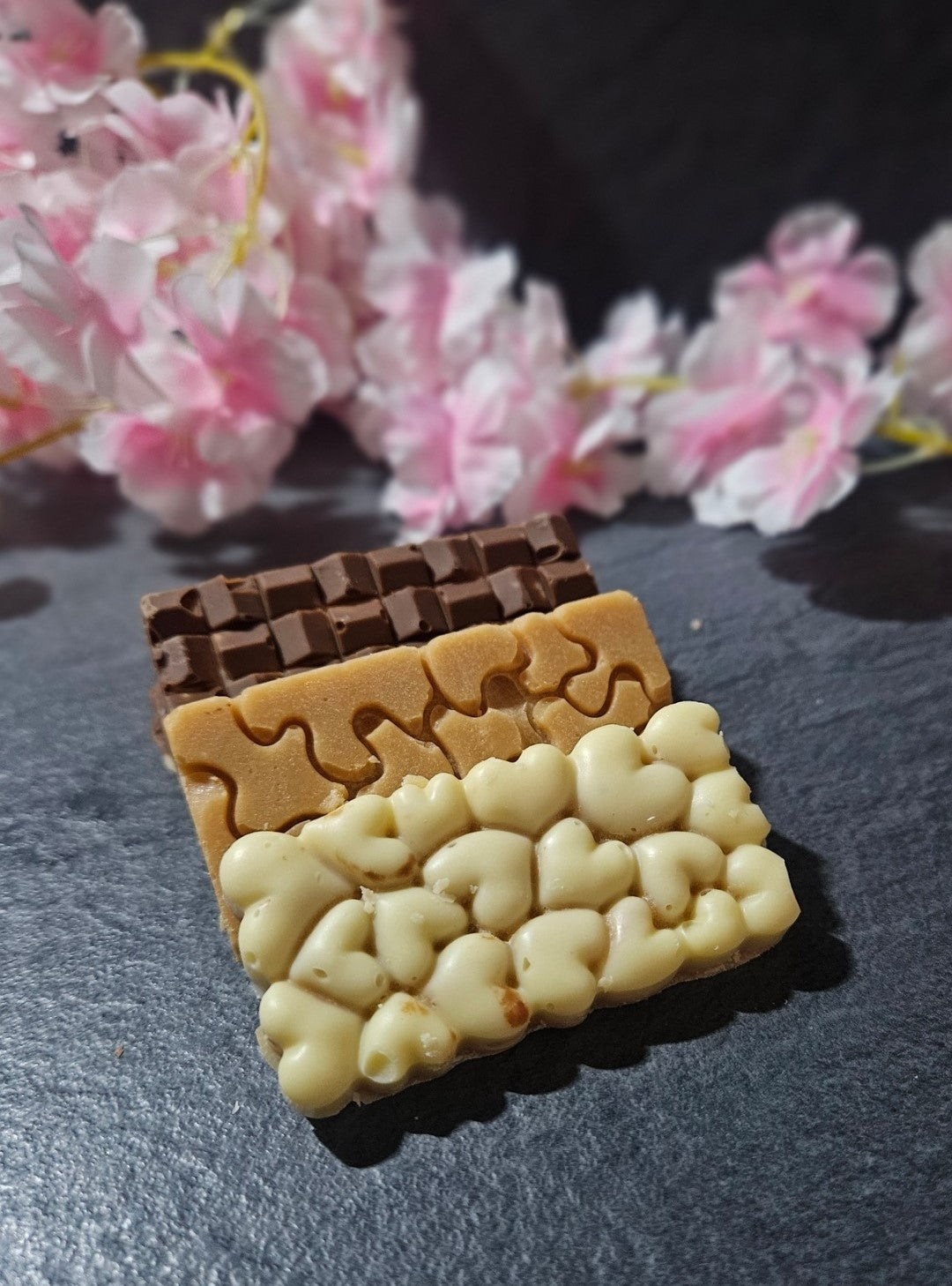 3 Assorted small fudge bars on grey background