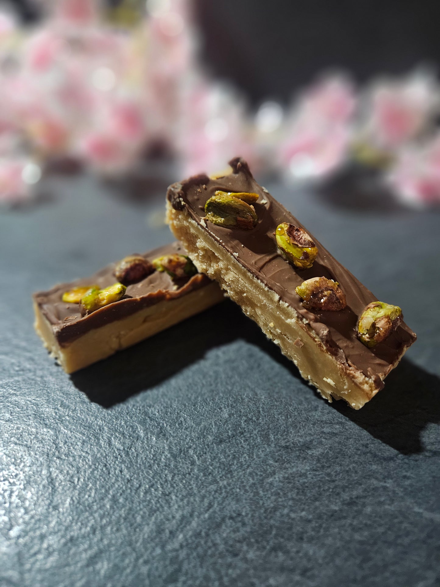 pistachio and milk chocolate fudge bars laid together