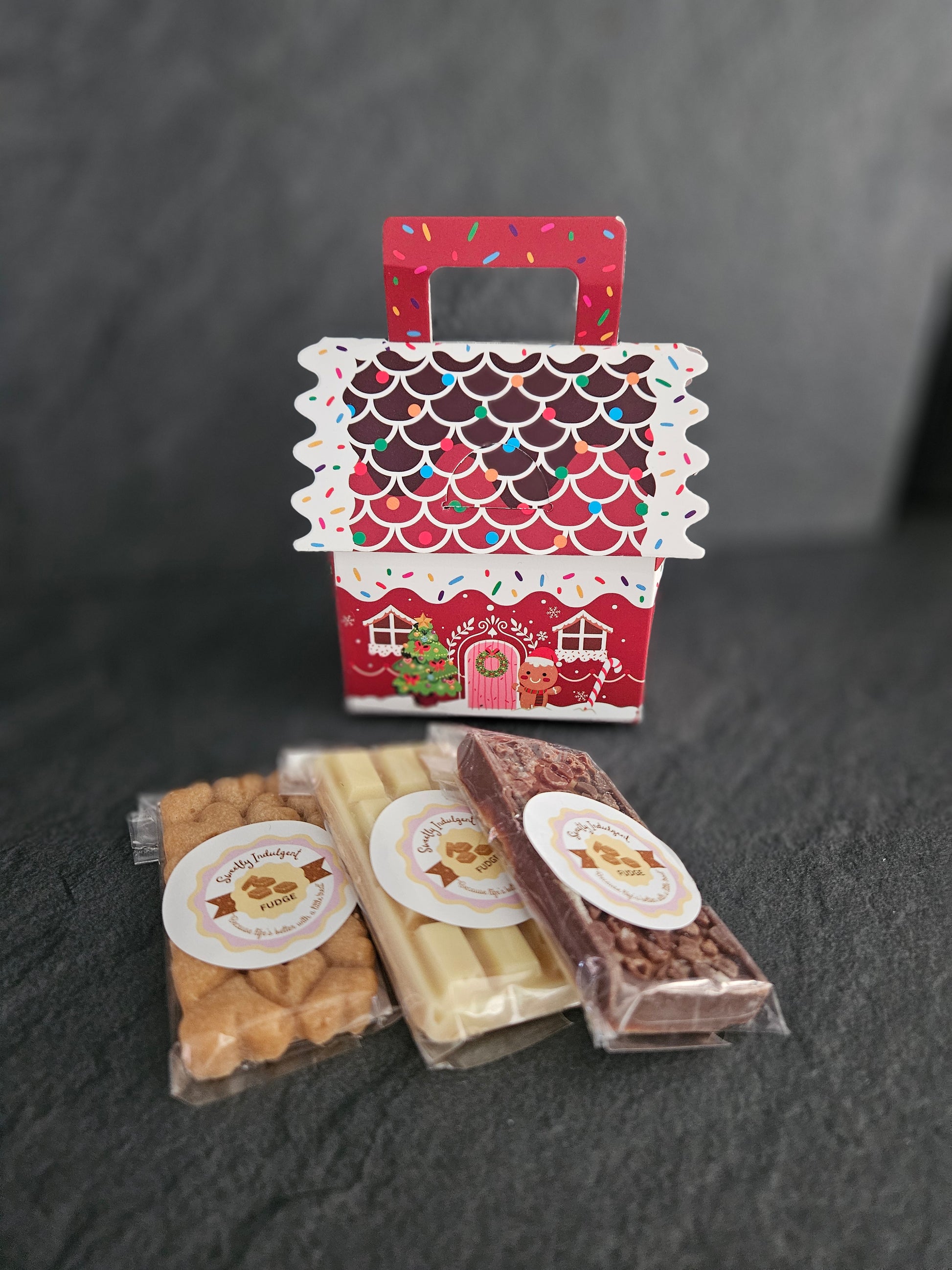 plain, white and milk chocolate fudge bars with Christmas decoration 