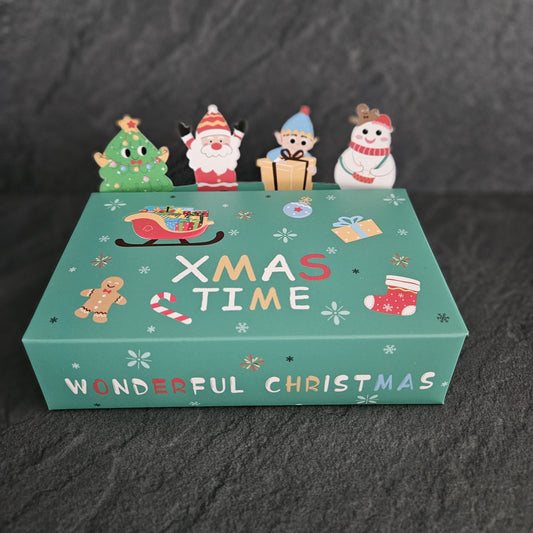 Christmas-themed product packaging with cartoon characters on a dark background