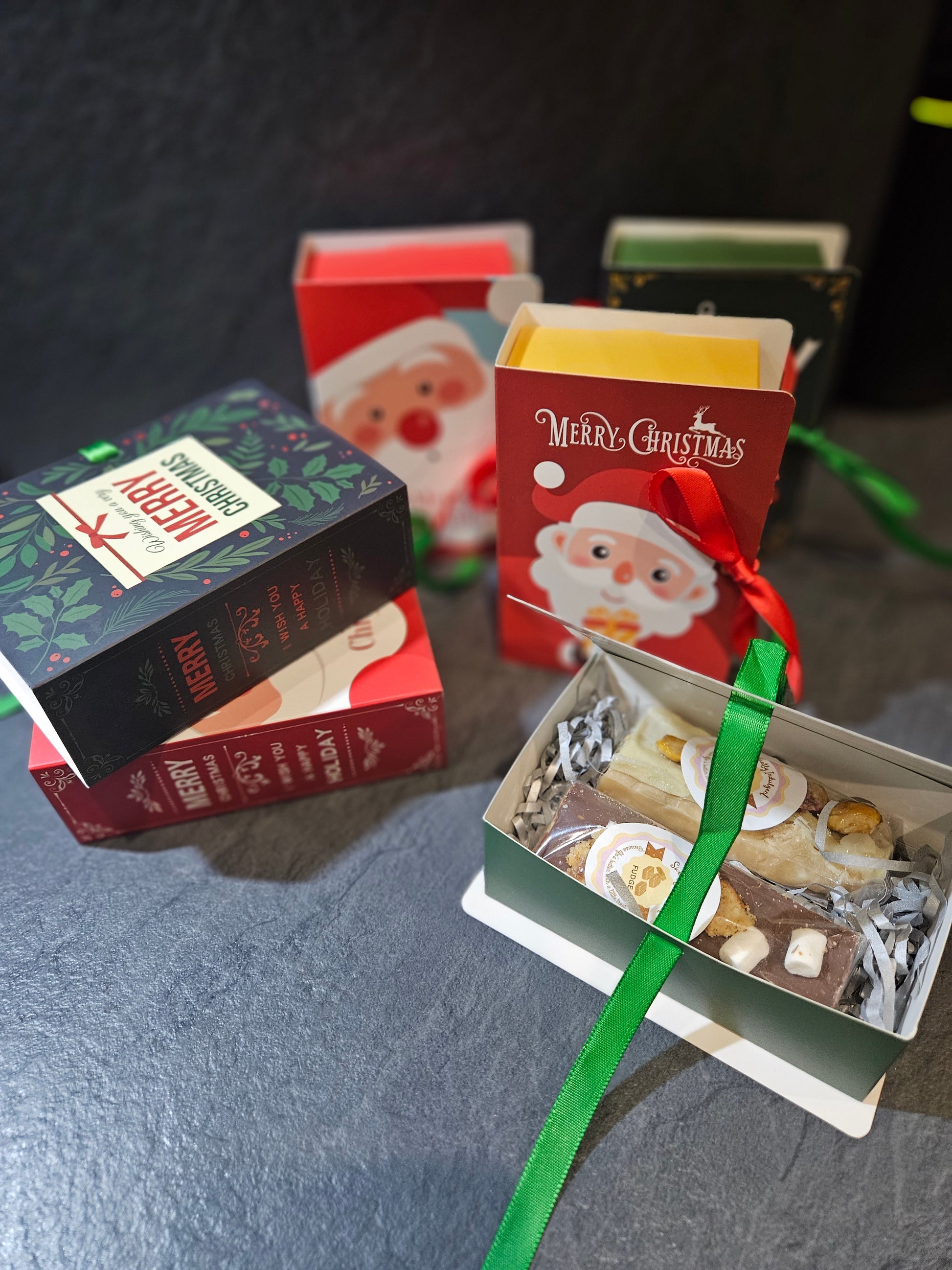 Novelty gift boxes in the form of a book showing 2 fudge bars inside 