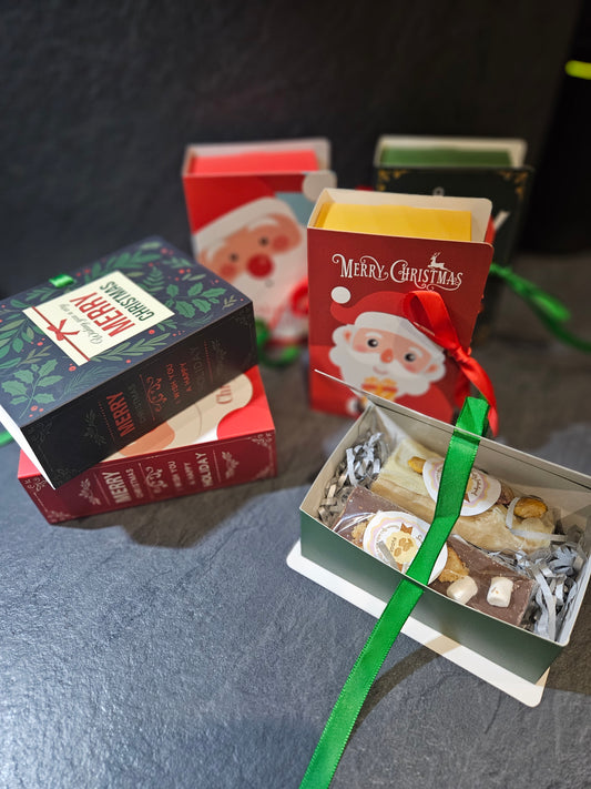 Novelty gift boxes in the form of a book showing 2 fudge bars inside 