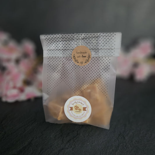 Bag of artisan fudge with Sweetly Indulgent Fudge branding  on grey background