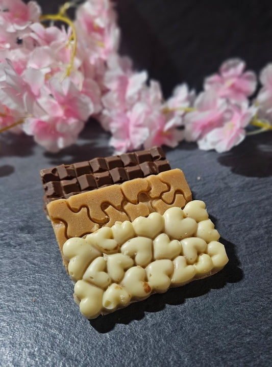 3 Assorted small fudge bars on grey background