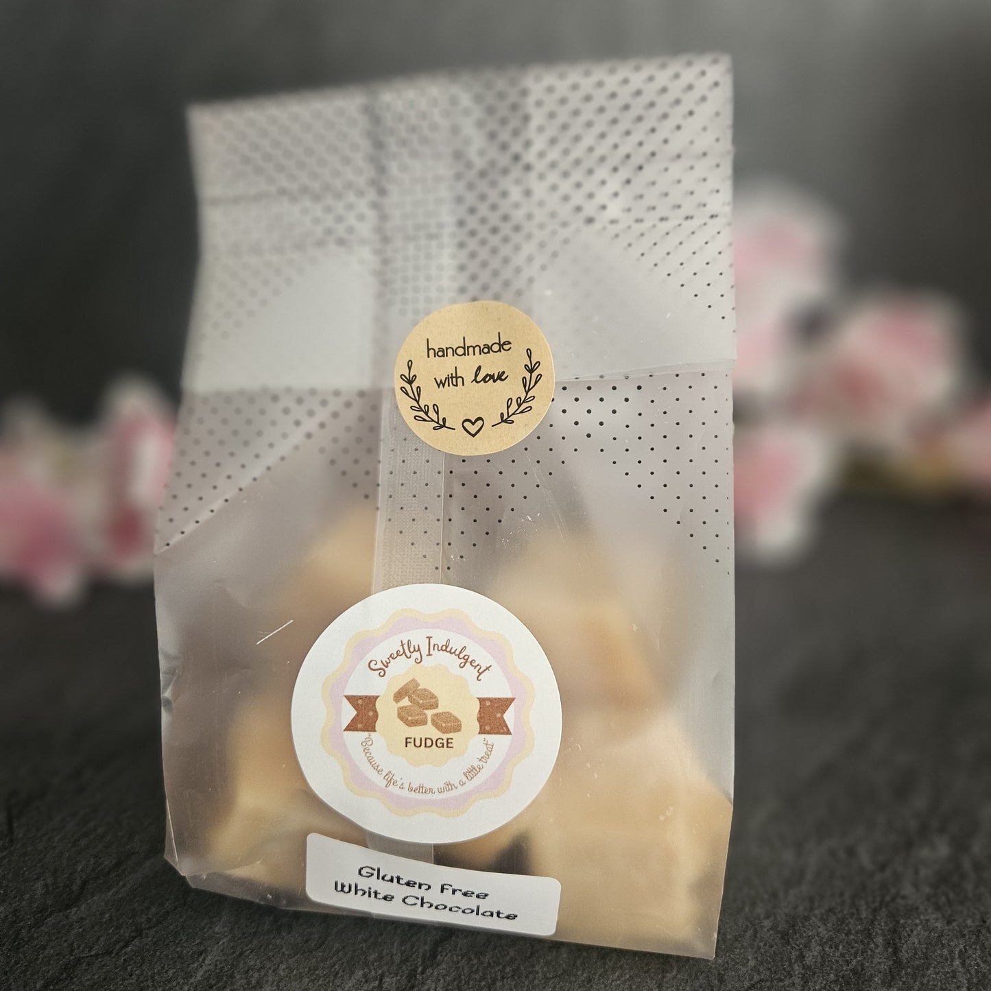 Clear packaging with Gluten free label, sealed with homemade with love label on a dark background